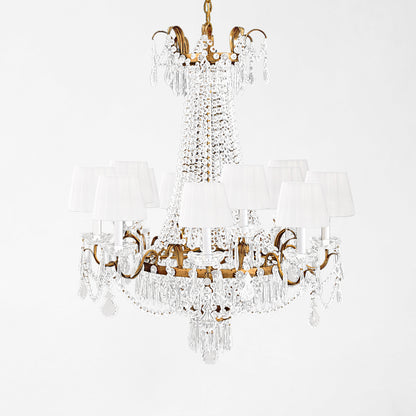 Luxurious antique gold Italian chandelier with white pleated shades.