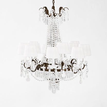 Traditional Italian chandelier with black trim and white pleated shades.