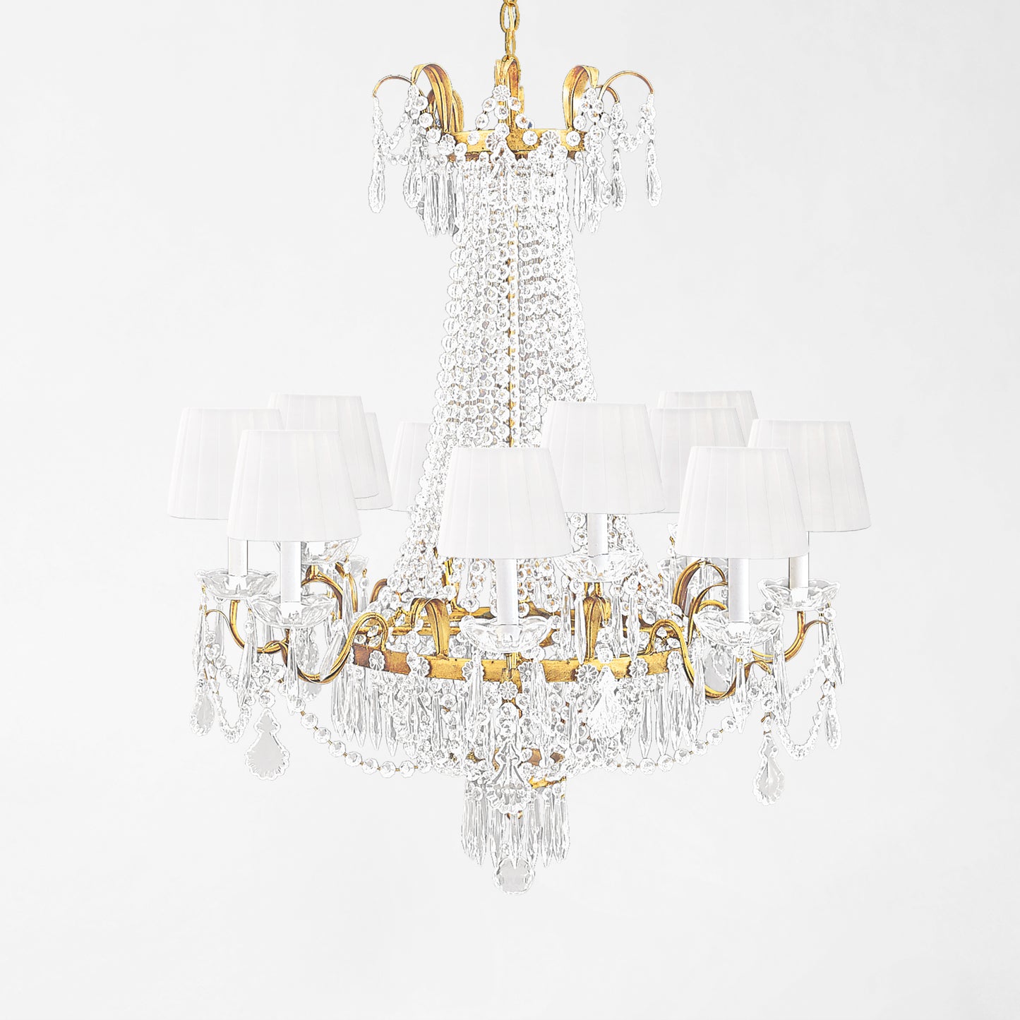 Gold Italian chandelier with white pleated shades and crystals.