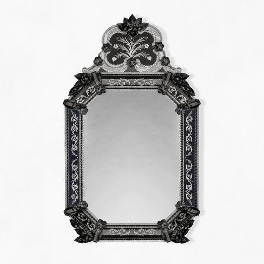Ornate black Venetian glass mirror.