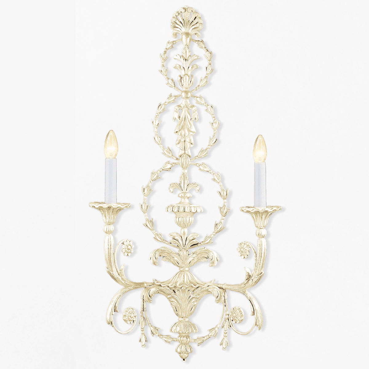 Antique white luxury sconce with intricate carved details.