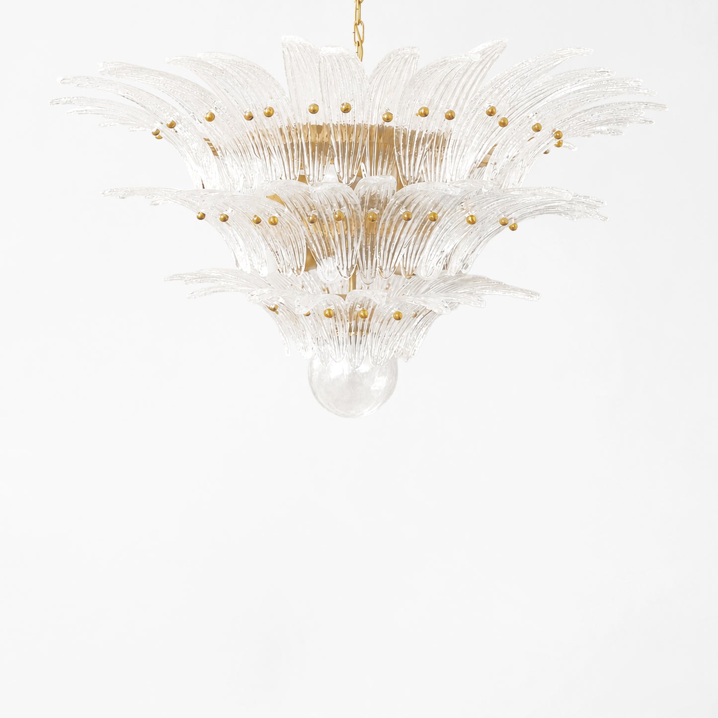 Clear Palm Murano glass chandelier with gold hardware.