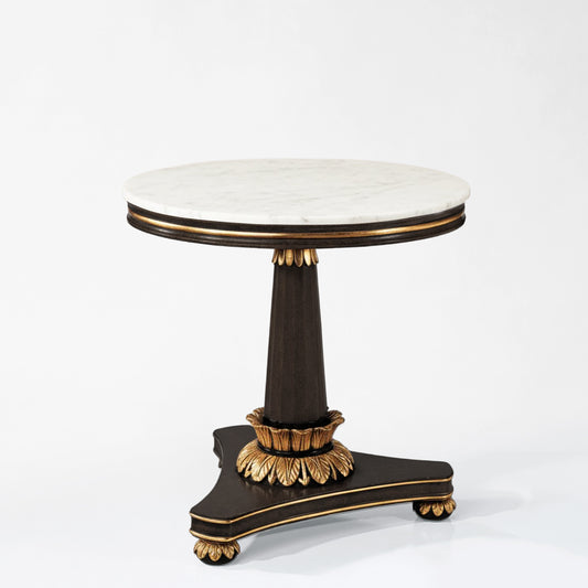 Black Italian table with gold details and white marble top.