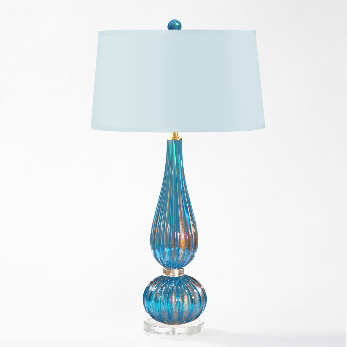 Blue Murano glass lamp with light blue lamp shade.