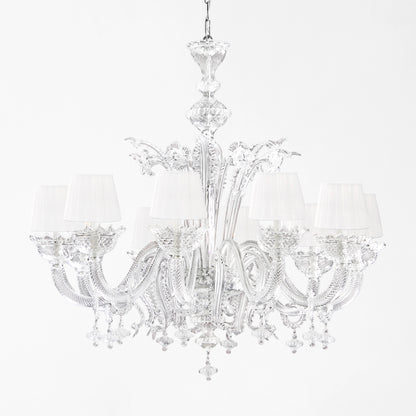 Luxurious Murano glass chandelier with clear glass and white pleated shades.