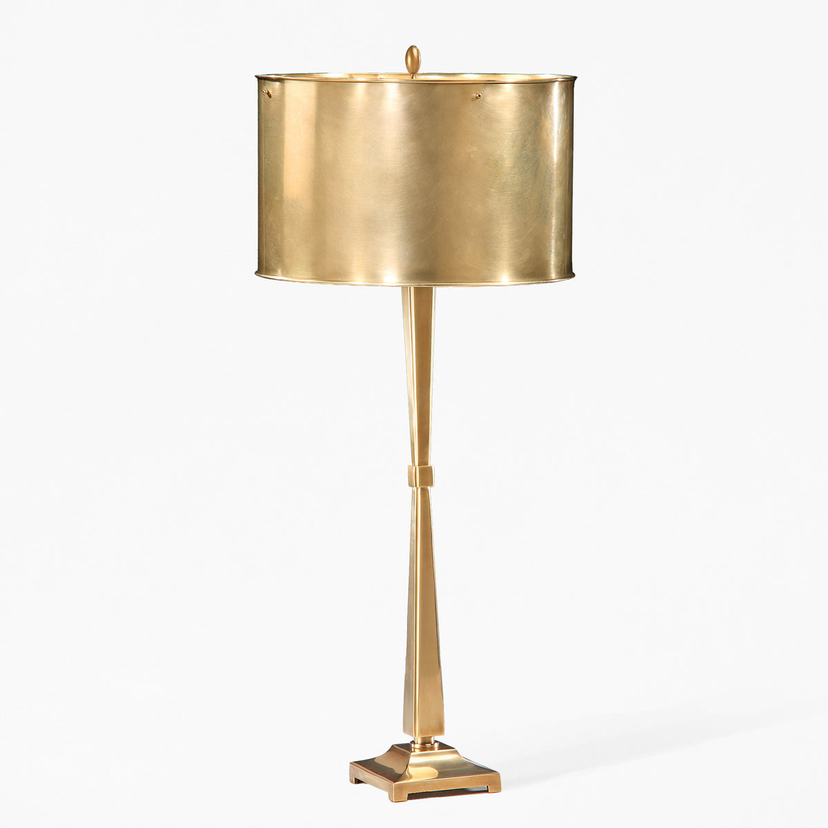 Antique brass lamp with antique brass lamp shade.