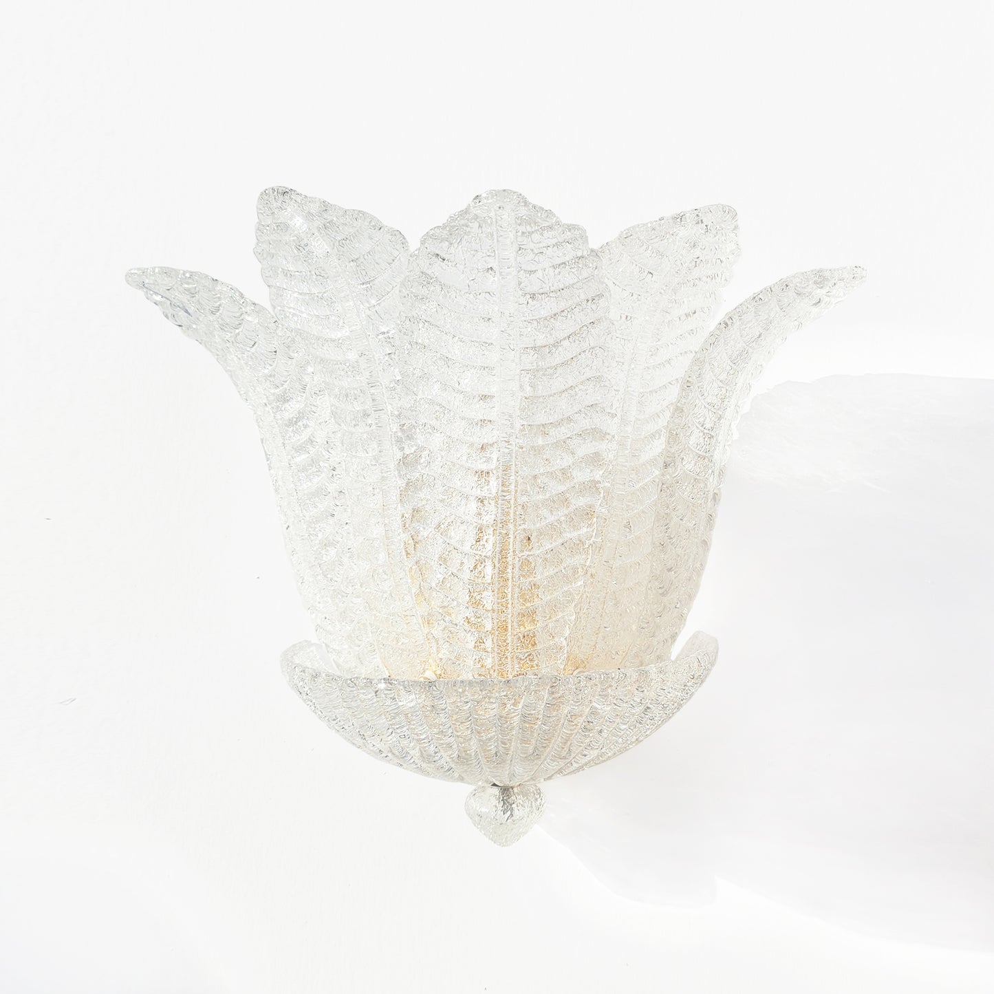 Italian luxury sconce with glass leaves.