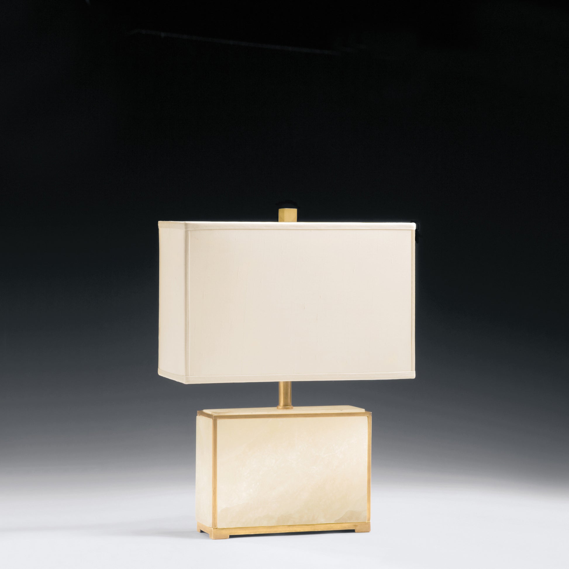 Alabaster table lamp with antique brass accent and modern rectangular shade.