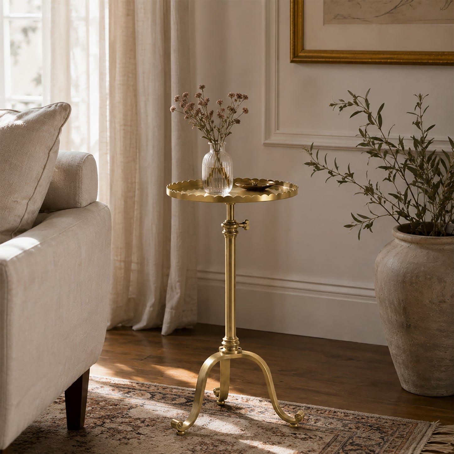 Antique brass accent table in luxurious living room.