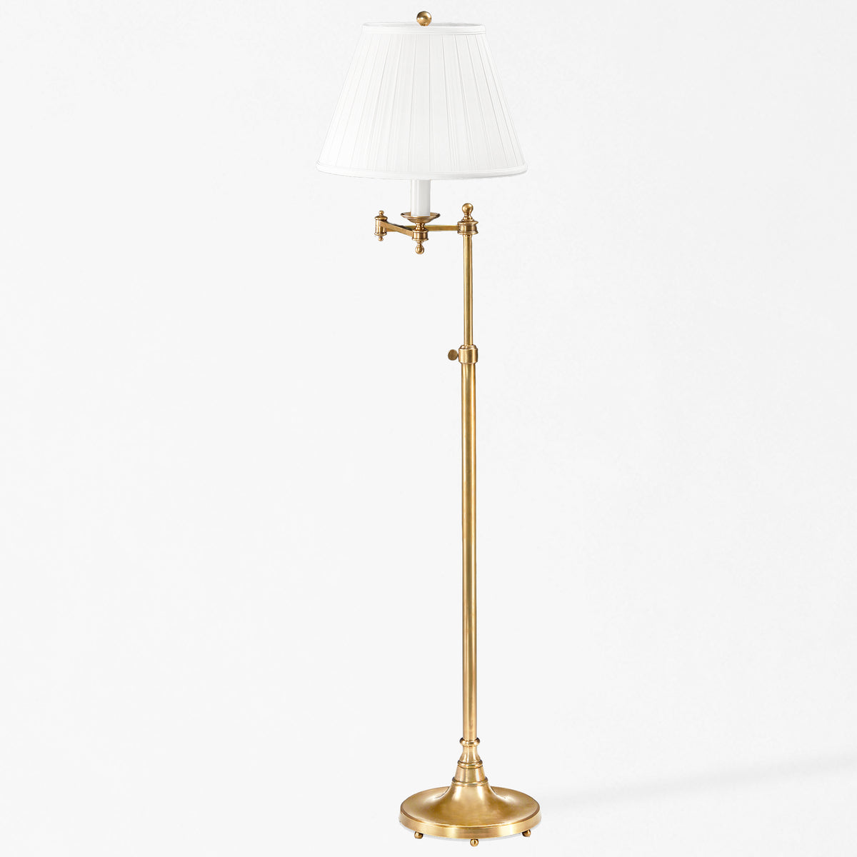 An antique brass floor lamp