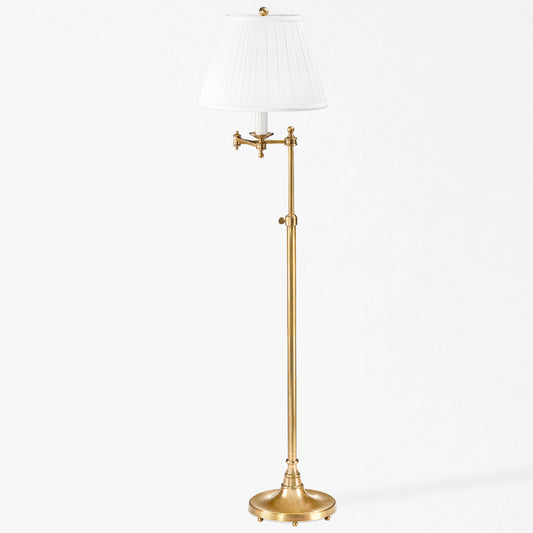 An antique brass floor lamp