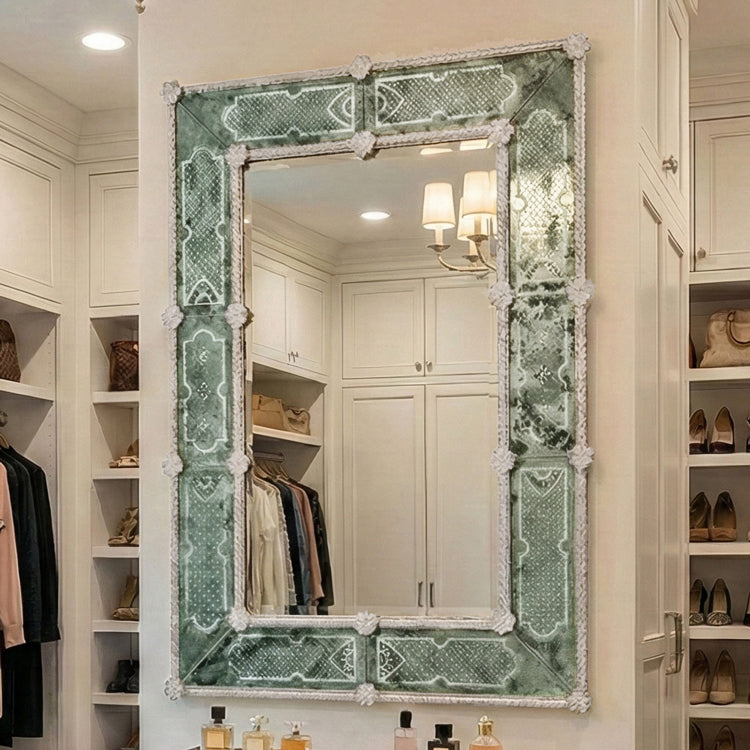 Antique green Murano glass mirror in luxurious walk-in closet.
