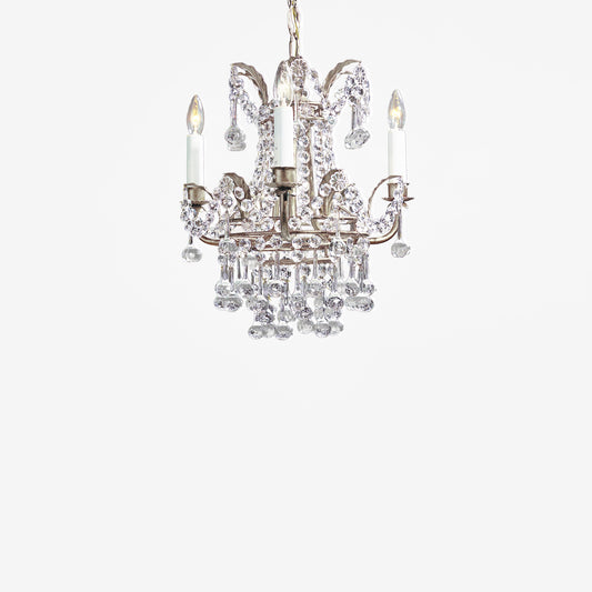 Italian chandelier with antique silver leaf and crystals.