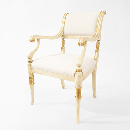 Antique white Italian chair with white fabric and carved gold details.