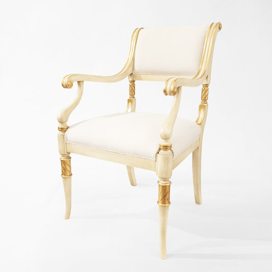 Antique white Italian chair with white fabric and carved gold details.