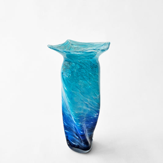 Aqua glass vase with swirl design.