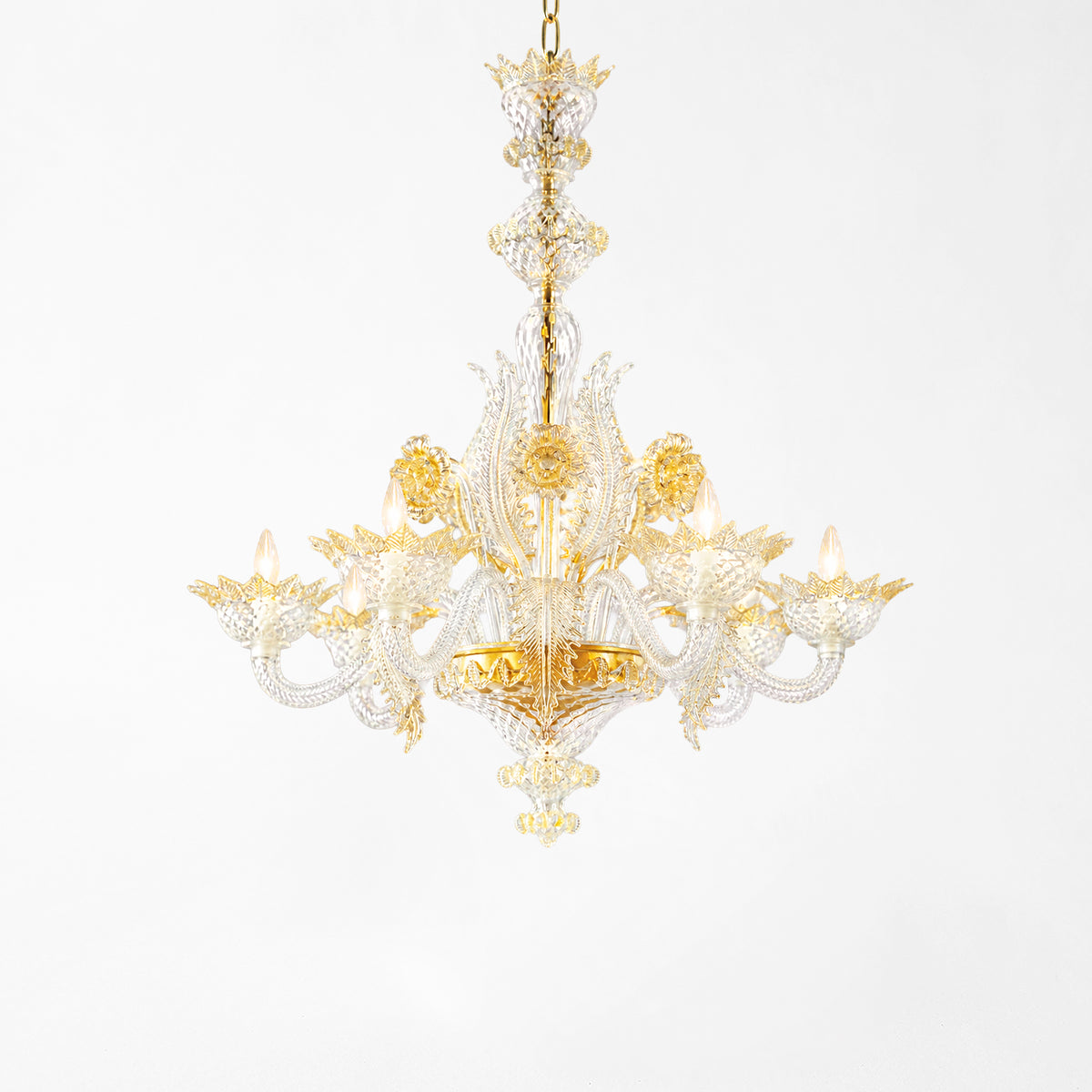 Luxurious Murano glass chandelier with gold accents and clear glass.