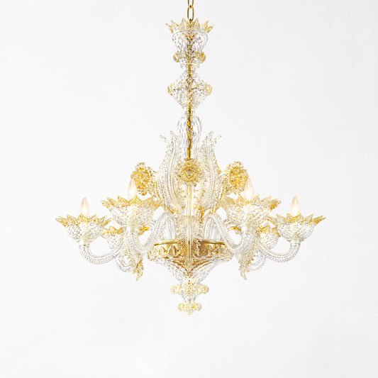 Luxurious Murano glass chandelier with gold accents and clear glass.