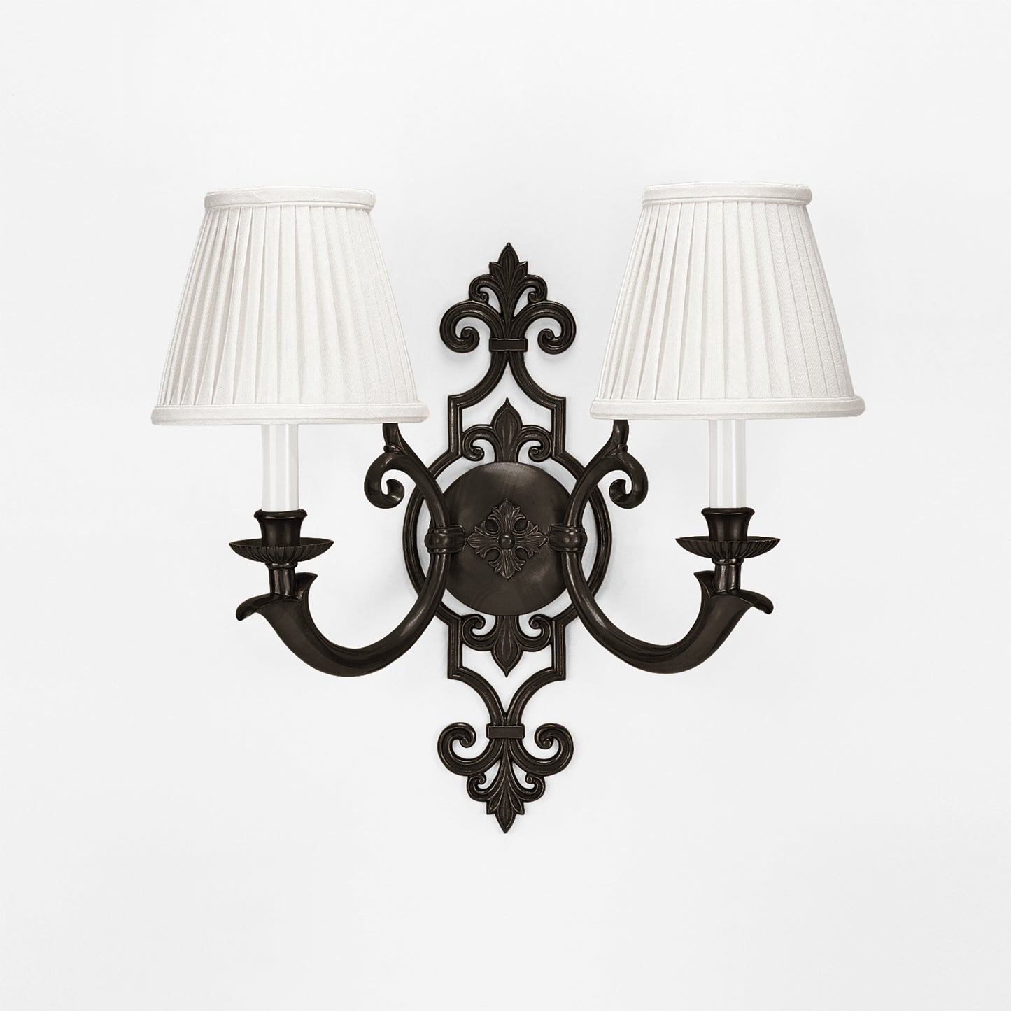 An antique brass sconce with a black finish.