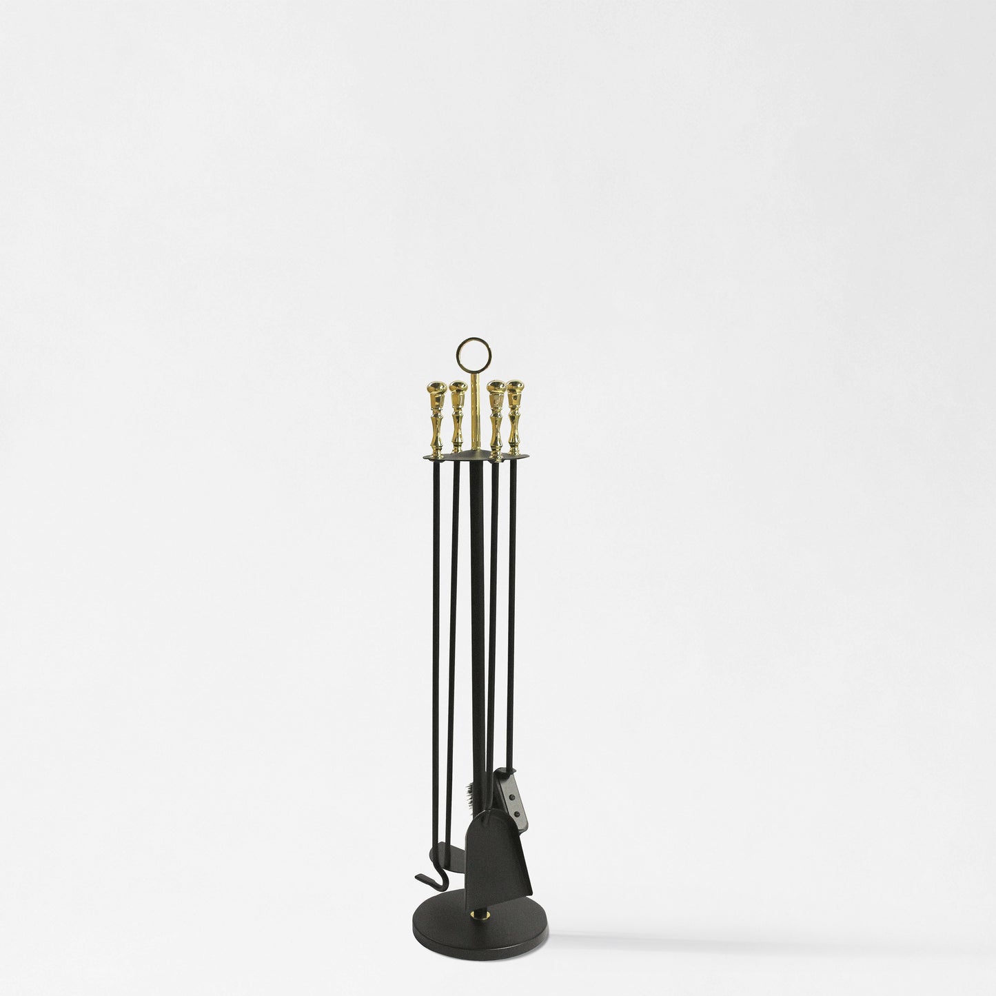 Black and brass fireplace tool set.