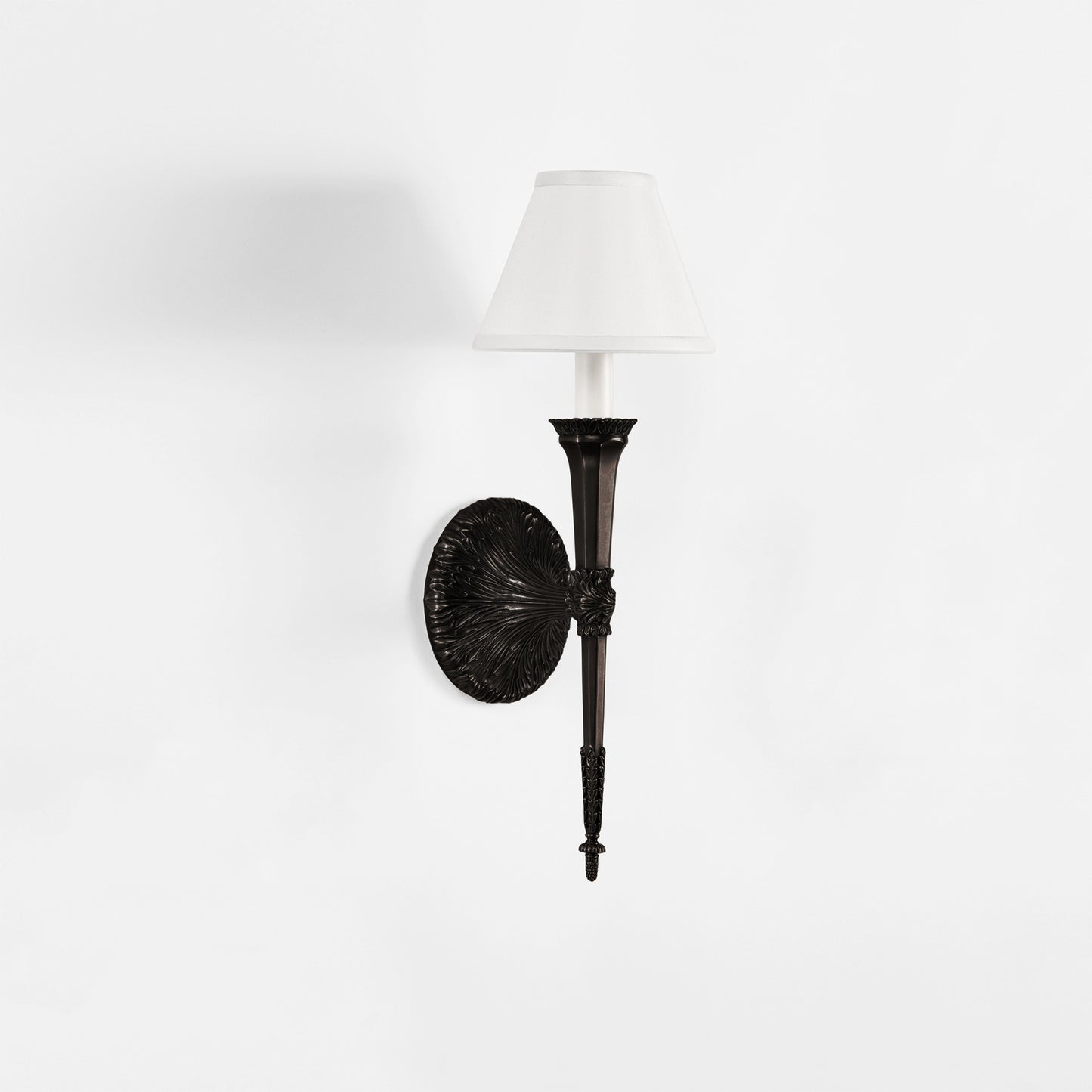 Traditional black sconce with white shade.