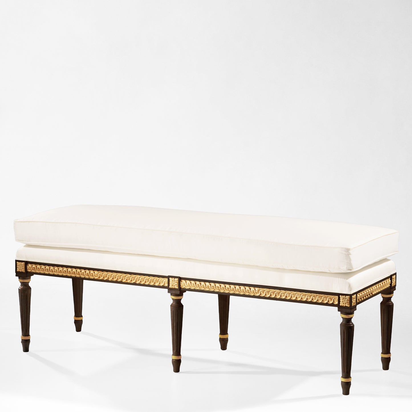 Traditional Italian black bench with gold details and white fabric.