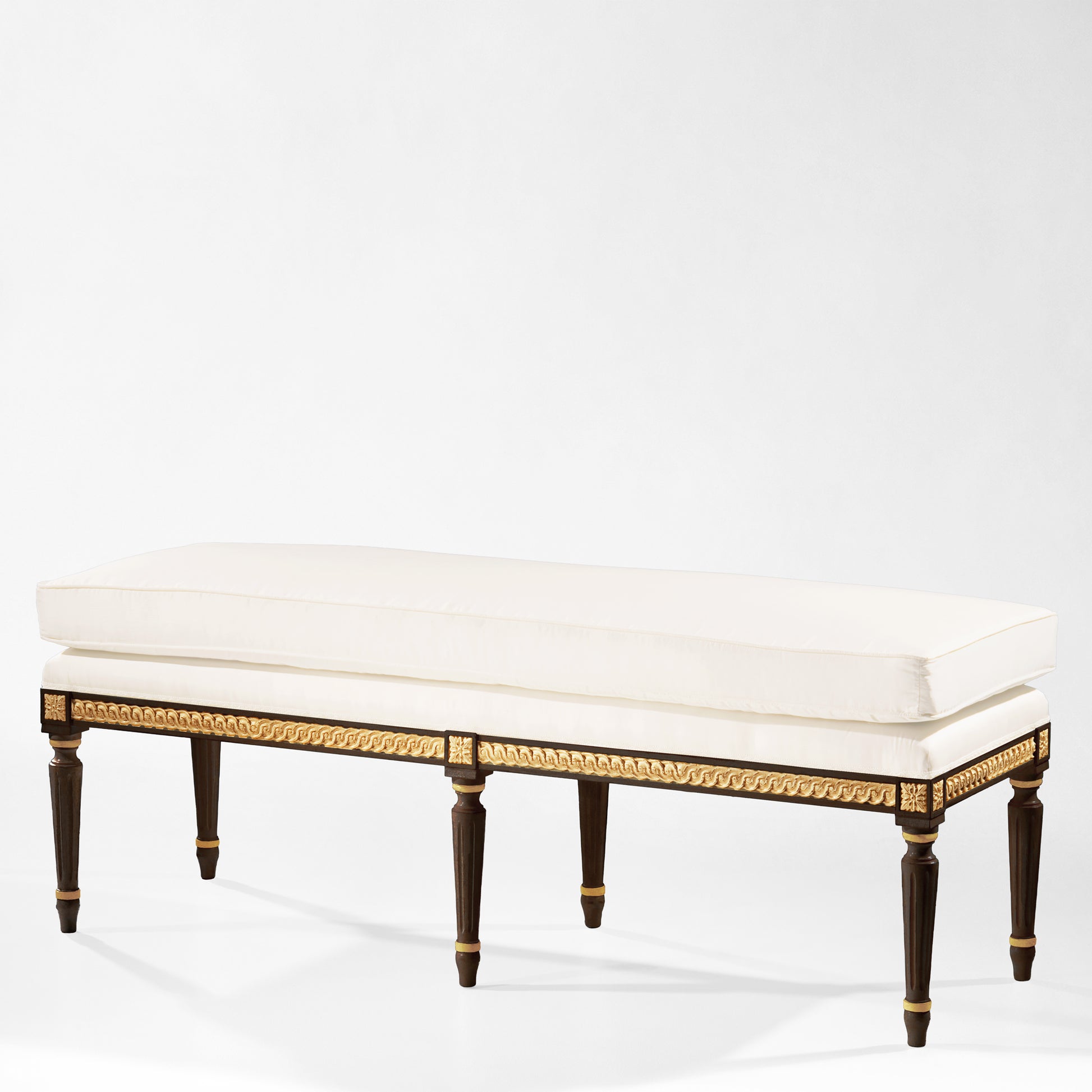 Traditional Italian black bench with gold details and white fabric.