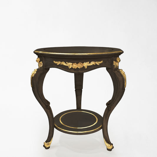 Round black side table with intricate gold details.