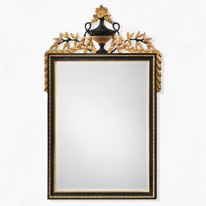 Traditional black mirror with carved gold details.
