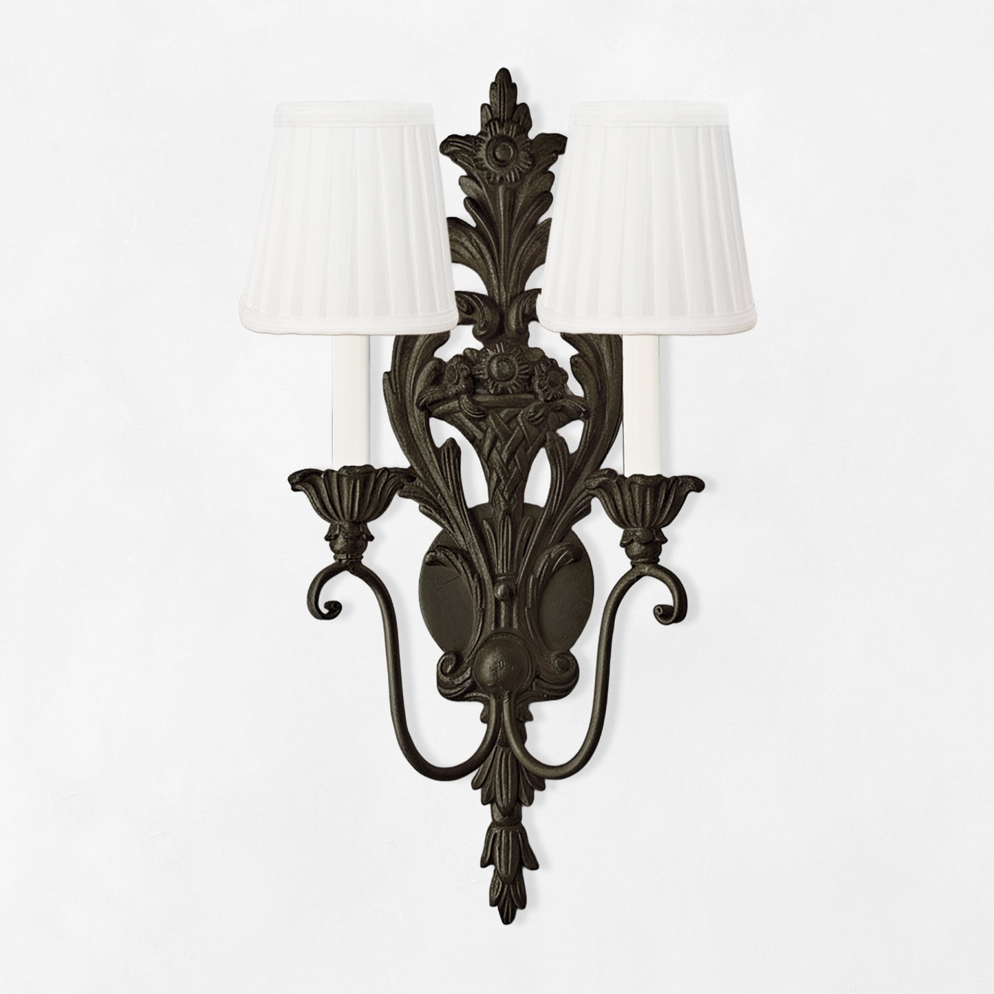 Black sconce with white pleated shades.