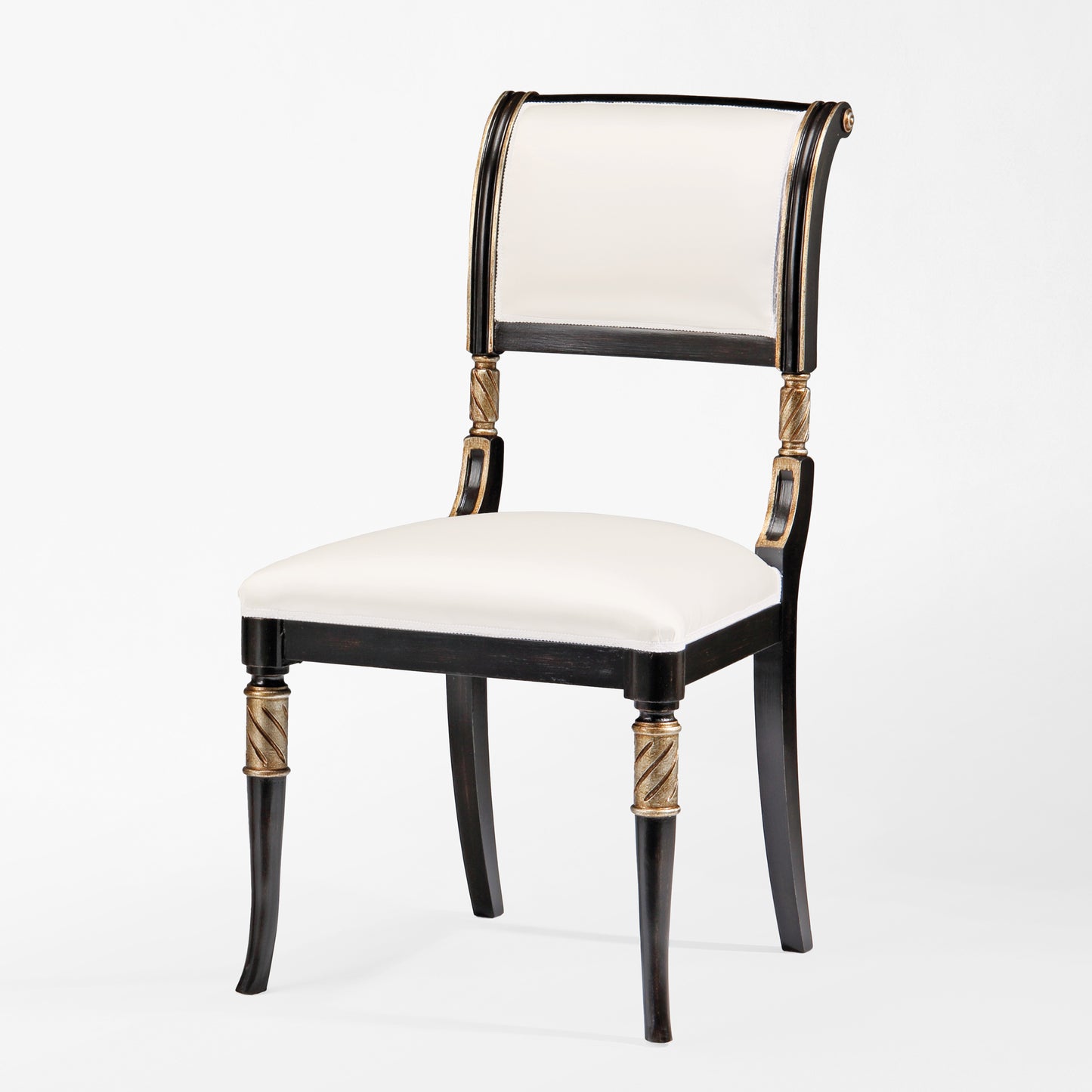 Black chair with silver details and white fabric.