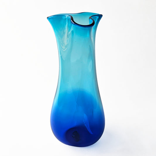 Aqua glass vase with modern design.