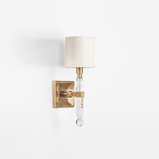 Brass and crystal sconce.