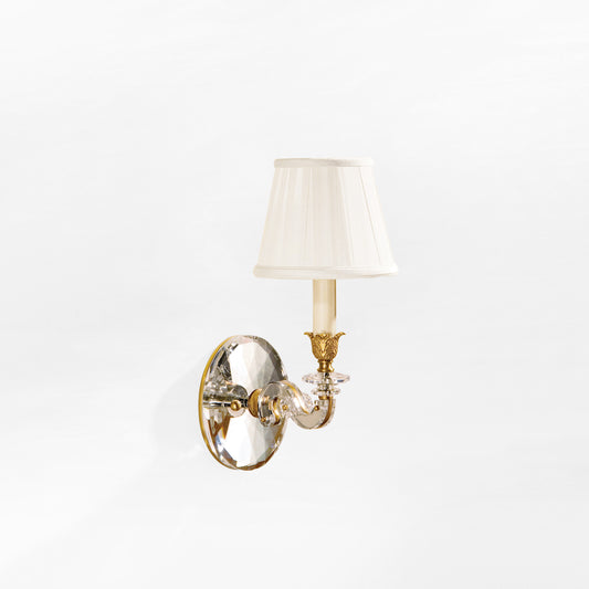 Brass and crystal sconce.