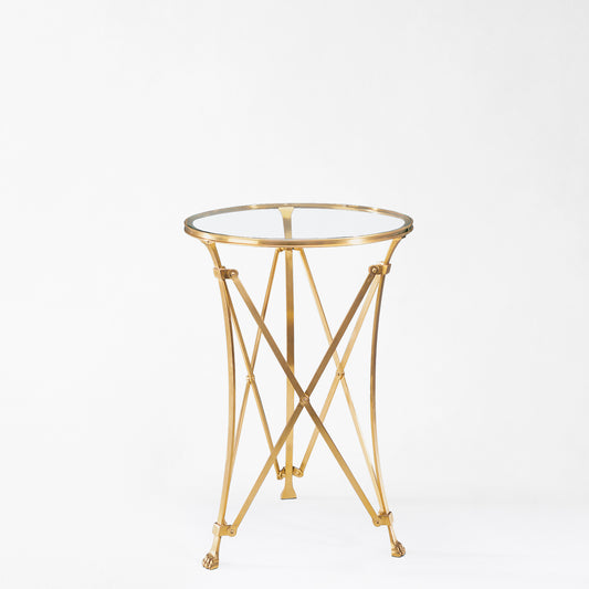 Brass gueridon table with glass top.