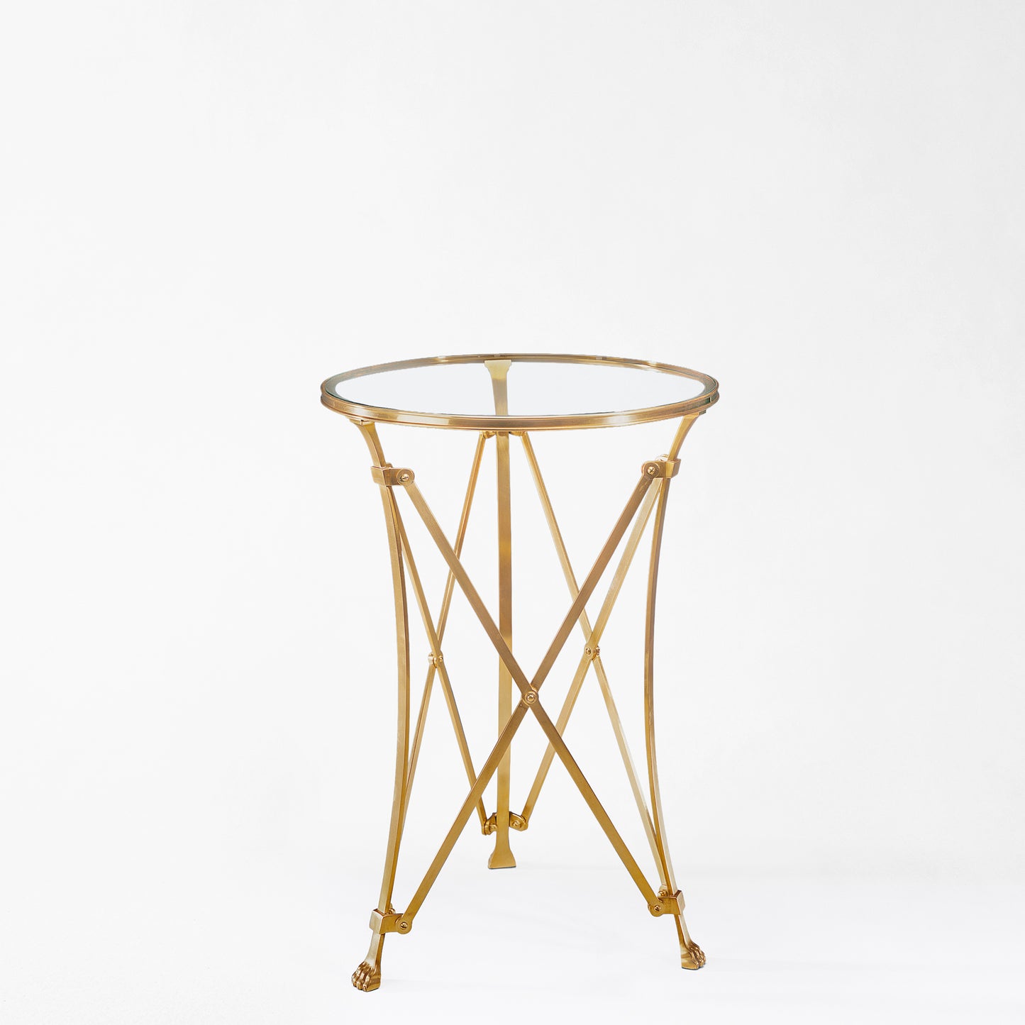 Brass gueridon table with glass top.