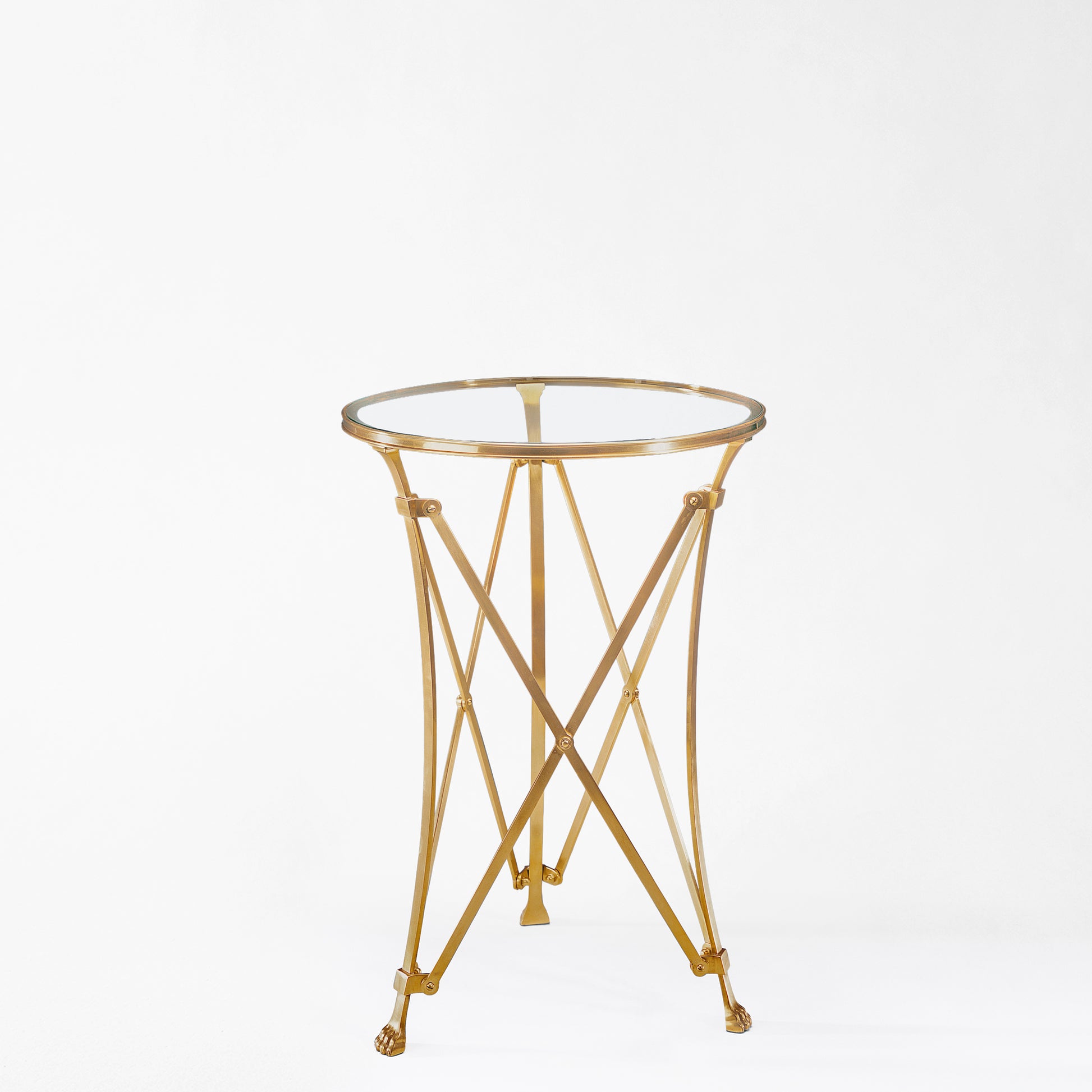 Brass gueridon table with glass top.