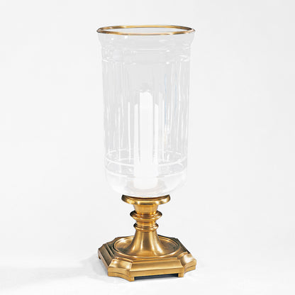Antique brass hurricane lamp with glass.