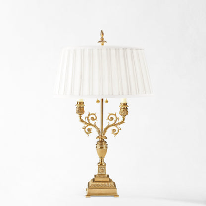 Brass table lamp with pleated shade.