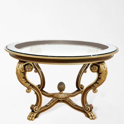 Ornate wood and gold center table with glass top.
