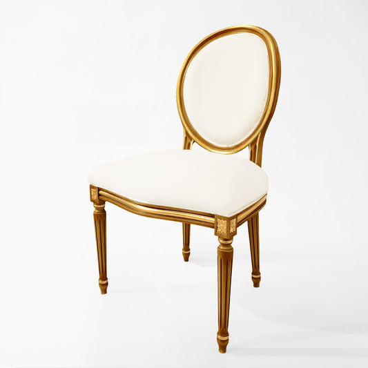 Carved wood Italian chair with cream fabric.