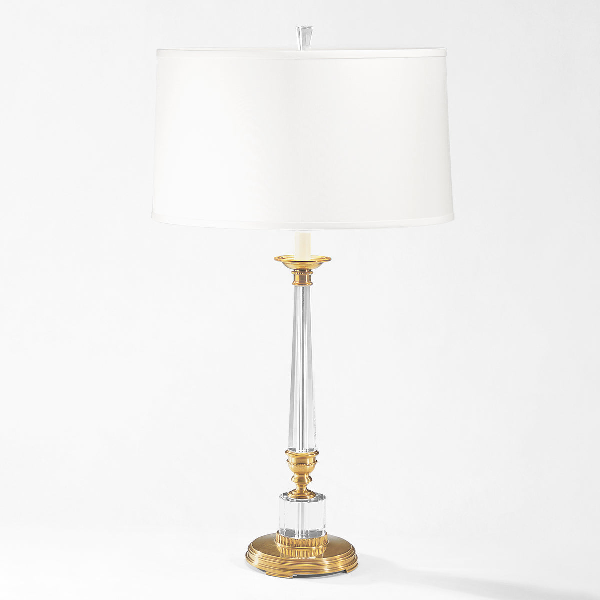 Crystal and brass table lamp with white linen shade.