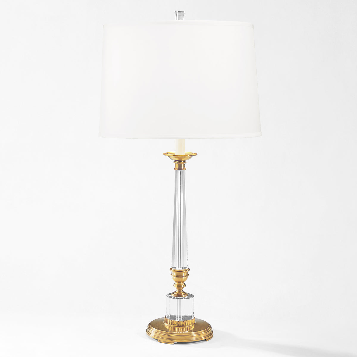 Crystal and brass table lamp with white linen shade.