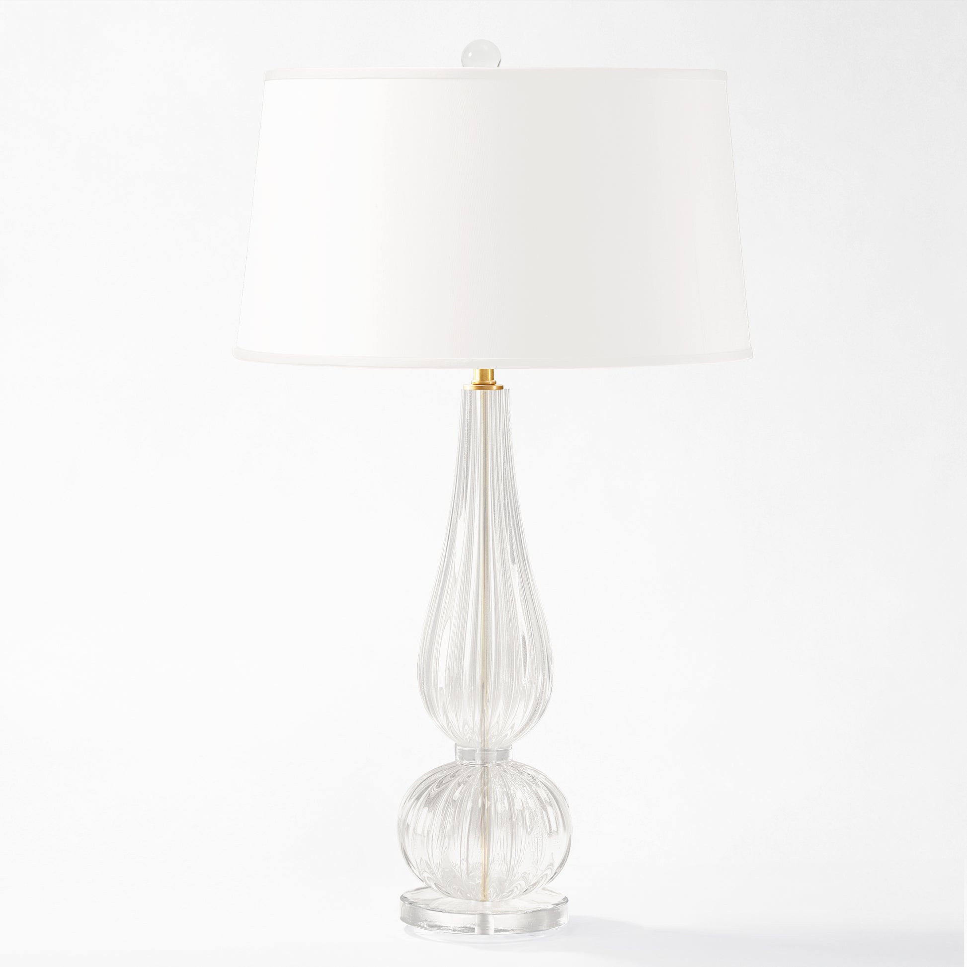 Clear Murano glass lamp with white shade.