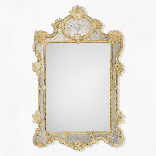 Antique Murano glass mirror with gold designs.