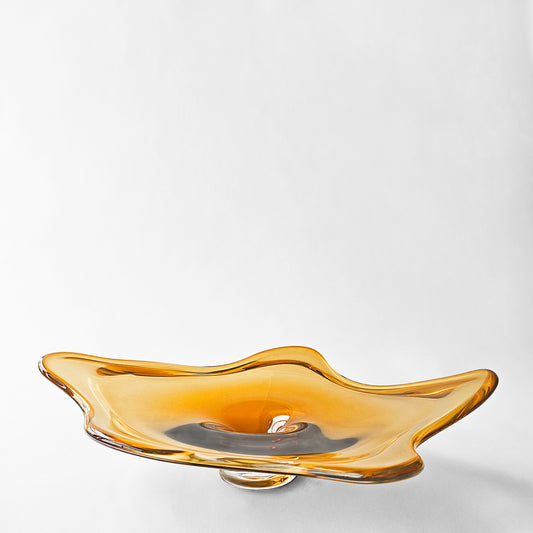 Gold glass decorative platter with modern design.