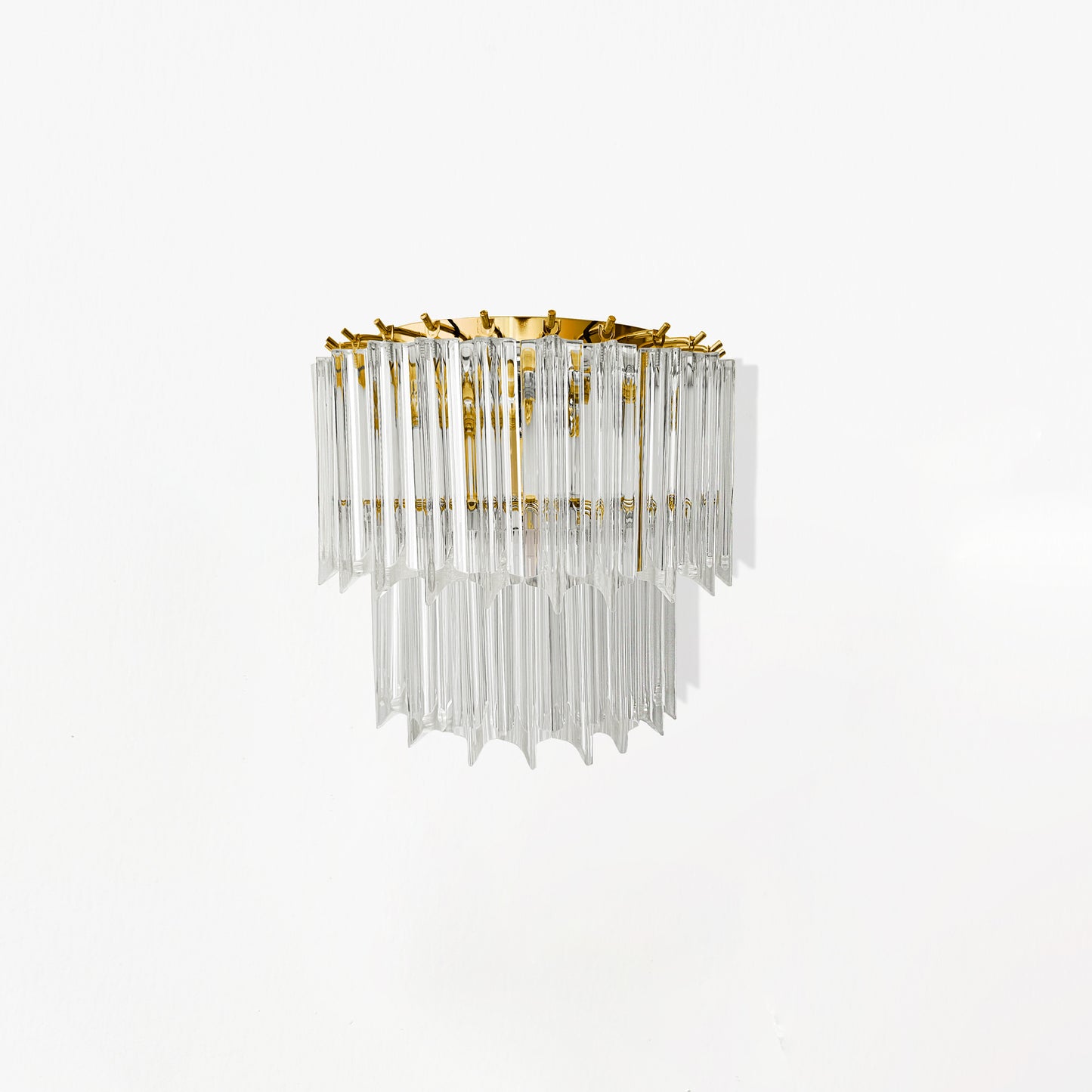 Clear and gold glass sconce.