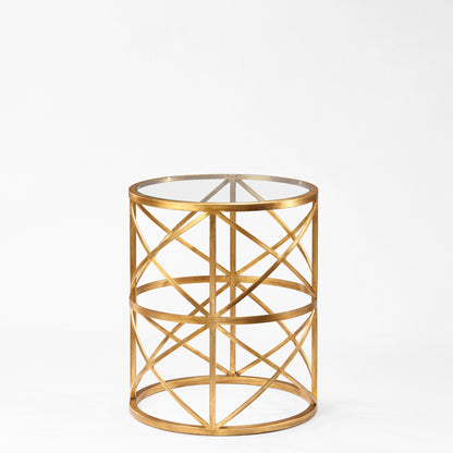Round gold side table with glass top.