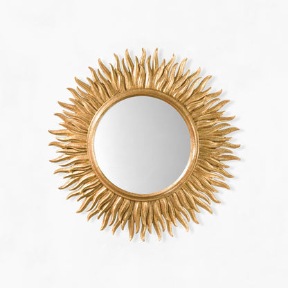 Gold sunburst mirror.