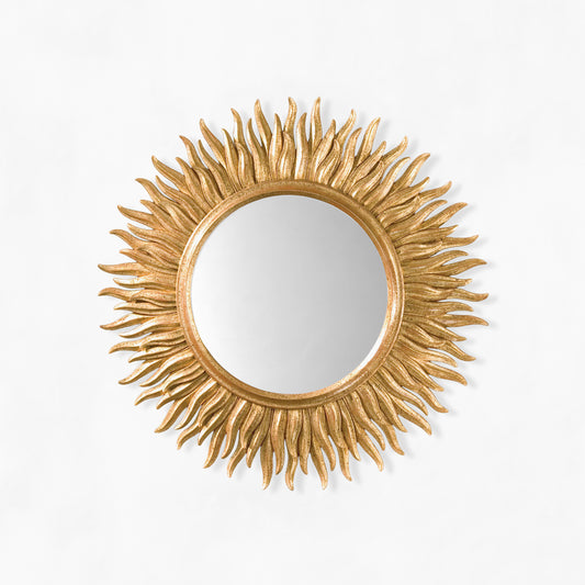 Gold sunburst mirror.